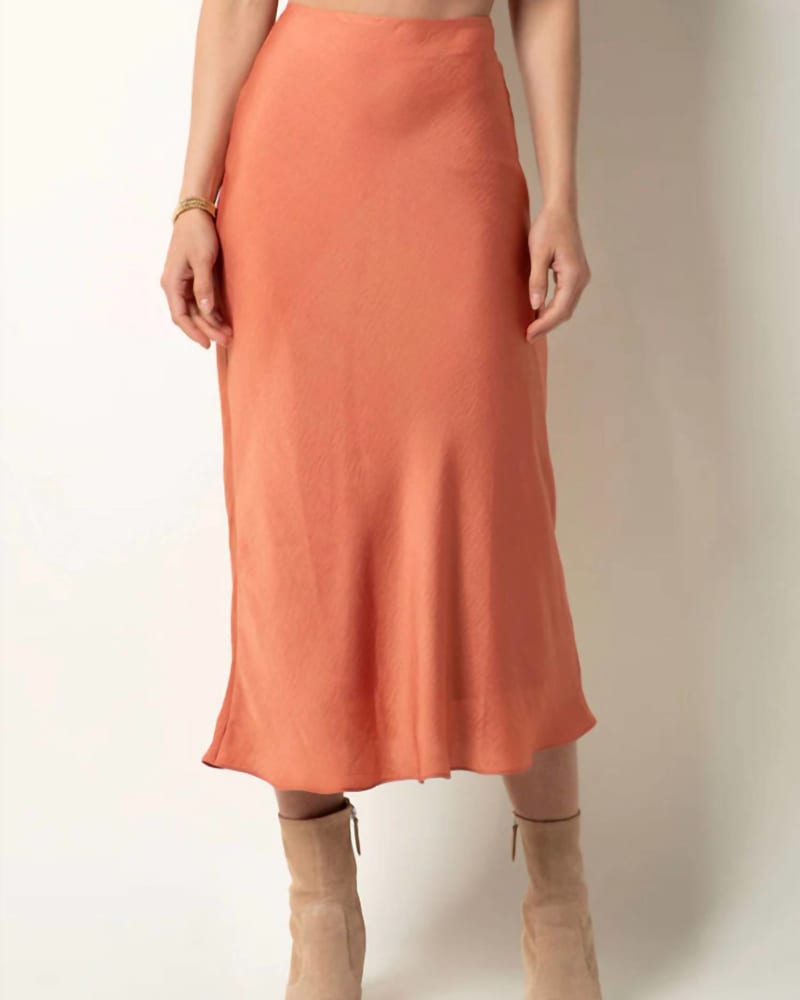 Front of a model wearing a size L Aysha Midi Skirt in Copper Coin in Copper Coin by Tart Collections. | dia_product_style_image_id:332289